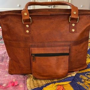 Genuine leather satchel bag with exterior pocket,